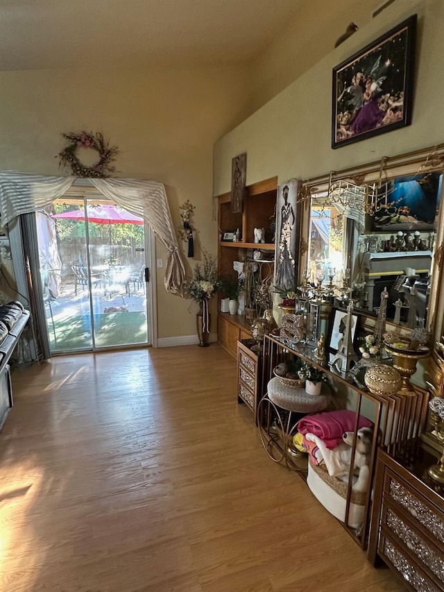6675 N Lola Ave, Fresno, CA 93722 - interior space with wood finished floors, plenty of natural light, and vaulted ceiling