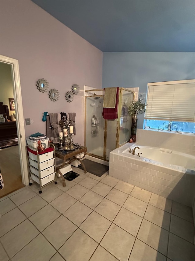 6675 N Lola Ave, Fresno, CA 93722 - full bath with tile patterned floors, a bath, and a stall shower