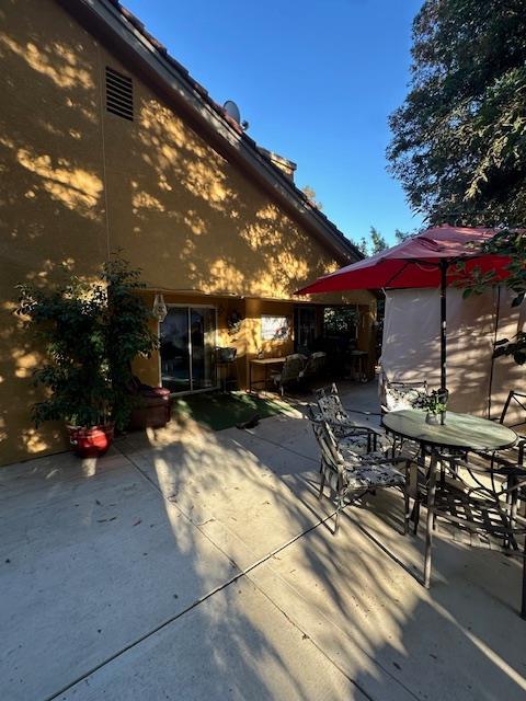 6675 N Lola Ave, Fresno, CA 93722 - view of patio / terrace featuring outdoor dining space