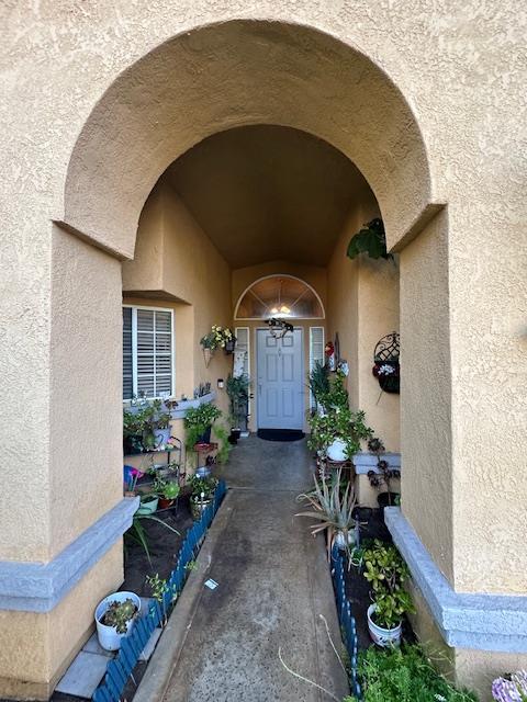 6675 N Lola Ave, Fresno, CA 93722 - property entrance featuring stucco siding