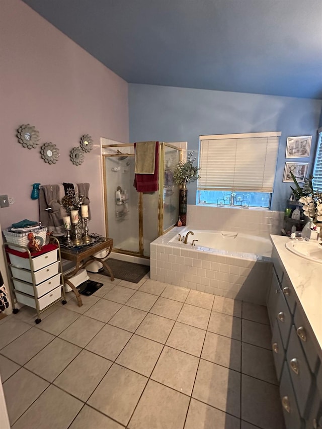 6675 N Lola Ave, Fresno, CA 93722 - bathroom featuring tile patterned flooring, a bath, vanity, and a stall shower