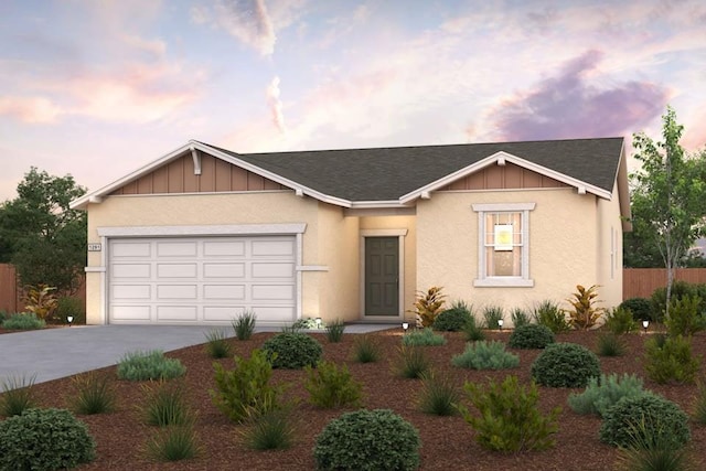 208 S Orange Ave, Reedley, CA 93654 - view of front of house featuring concrete driveway, board and batten siding, a garage, and roof with shingles