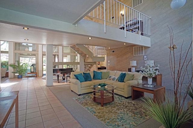 5513 N El Adobe Dr, Fresno, CA 93711 - tiled living area featuring stairway, a high ceiling, and plenty of natural light