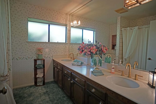 5513 N El Adobe Dr, Fresno, CA 93711 - bathroom featuring wallpapered walls, double vanity, and curtained shower
