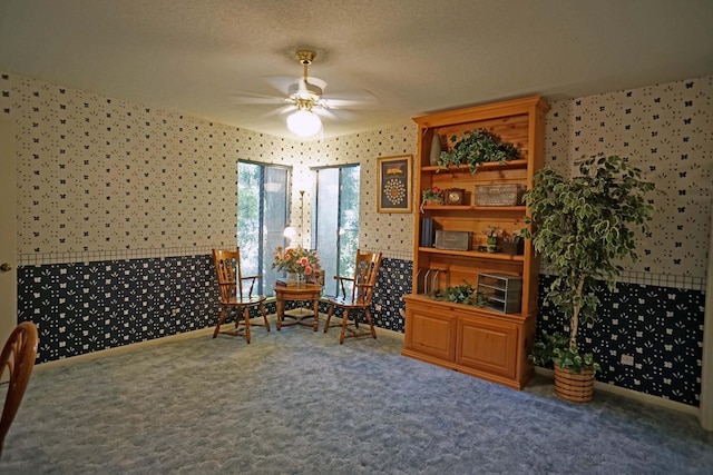 5513 N El Adobe Dr, Fresno, CA 93711 - sitting room with wallpapered walls, a ceiling fan, carpet, and a textured ceiling