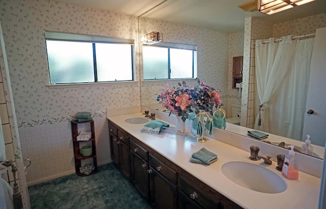 5513 N El Adobe Dr, Fresno, CA 93711 - full bathroom with double vanity, wallpapered walls, and a shower with shower curtain