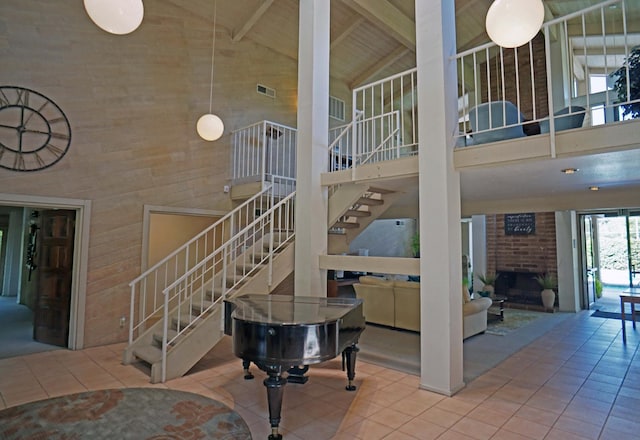 5513 N El Adobe Dr, Fresno, CA 93711 - stairs featuring high vaulted ceiling, tile patterned floors, a brick fireplace, and a wood ceiling with exposed beams