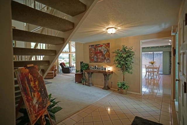 5513 N El Adobe Dr, Fresno, CA 93711 - carpeted living room featuring tile patterned flooring, stairs, and a textured ceiling