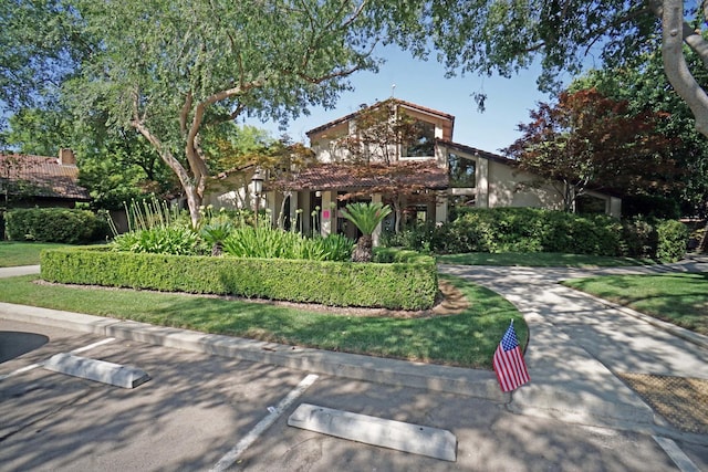 5513 N El Adobe Dr, Fresno, CA 93711 - view of front facade featuring stucco siding and uncovered parking