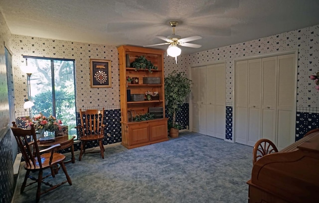 5513 N El Adobe Dr, Fresno, CA 93711 - living area with wallpapered walls, ceiling fan, and carpet