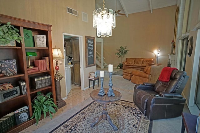 5513 N El Adobe Dr, Fresno, CA 93711 - tiled living area featuring high vaulted ceiling, a chandelier, stairs, and beam ceiling