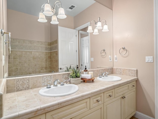1568 E Sterling Hill Way, Fresno, CA 93730 - full bath featuring double vanity and a chandelier