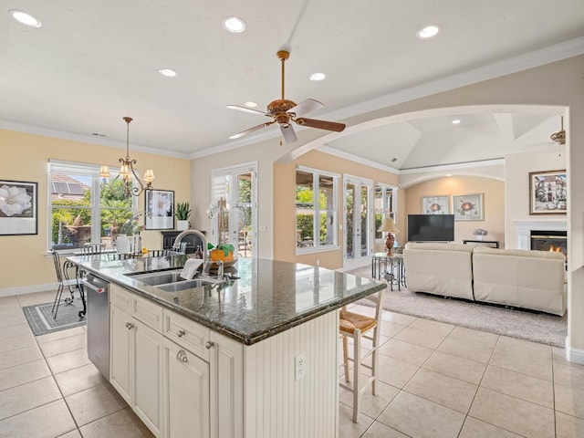 1568 E Sterling Hill Way, Fresno, CA 93730 - kitchen featuring light tile patterned flooring, dishwasher, a breakfast bar area, recessed lighting, and open floor plan