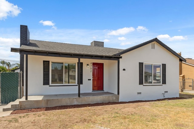 4752 E Kerckhoff Ave, Fresno, CA 93702 - single story home with a chimney, covered porch, crawl space, roof with shingles, and stucco siding