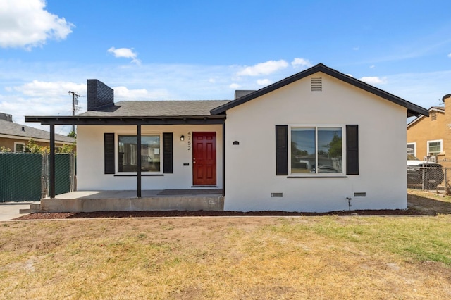4752 E Kerckhoff Ave, Fresno, CA 93702 - view of front of home with a porch, crawl space, stucco siding, roof with shingles, and a chimney