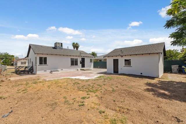 4752 E Kerckhoff Ave, Fresno, CA 93702 - rear view of house with stucco siding, a patio area, and an outdoor structure