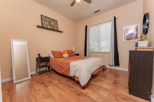 1774 Castle Way, Lemoore, CA 93245 - bedroom with light wood finished floors and a ceiling fan