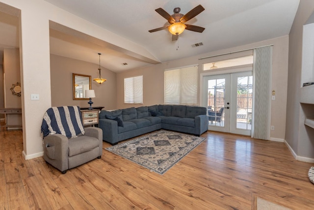 1774 Castle Way, Lemoore, CA 93245 - living area with lofted ceiling, wood finished floors, ceiling fan, and french doors