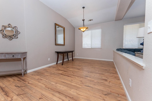 1774 Castle Way, Lemoore, CA 93245 - unfurnished dining area with light wood-style floors and lofted ceiling