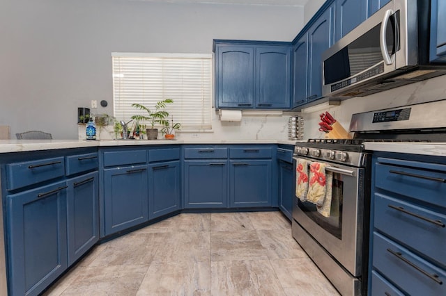 1774 Castle Way, Lemoore, CA 93245 - kitchen featuring stainless steel appliances and blue cabinetry
