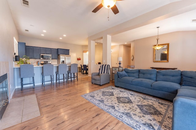 1774 Castle Way, Lemoore, CA 93245 - living room featuring light wood finished floors, ceiling fan, and recessed lighting