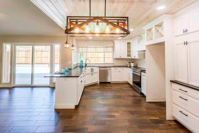 2540 Burgan Ave, Clovis, CA 93611 - kitchen with appliances with stainless steel finishes, a peninsula, wood ceiling, dark countertops, and recessed lighting