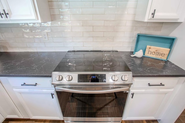 2540 Burgan Ave, Clovis, CA 93611 - kitchen with electric range, decorative backsplash, and white cabinetry
