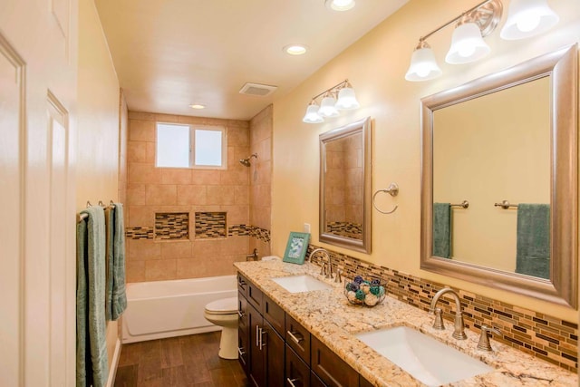 2540 Burgan Ave, Clovis, CA 93611 - bathroom featuring double vanity, shower / bathtub combination with curtain, wood finished floors, recessed lighting, and decorative backsplash