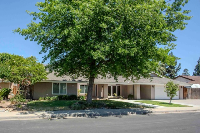 2540 Burgan Ave, Clovis, CA 93611 - view of front of home featuring a garage, concrete driveway, and stucco siding