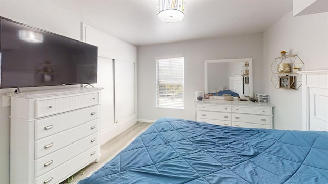 491 W Fir Ave, Pinedale, CA 93650 - bedroom featuring light wood-type flooring and baseboards
