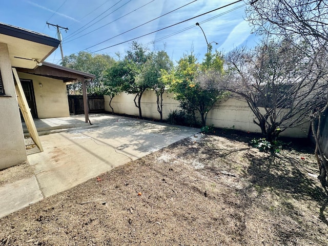 535 W Peralta Way, Fresno, CA 93705 - fenced backyard with a patio