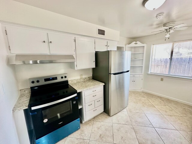 535 W Peralta Way, Fresno, CA 93705 - kitchen with range with electric stovetop, under cabinet range hood, freestanding refrigerator, a ceiling fan, and white cabinets