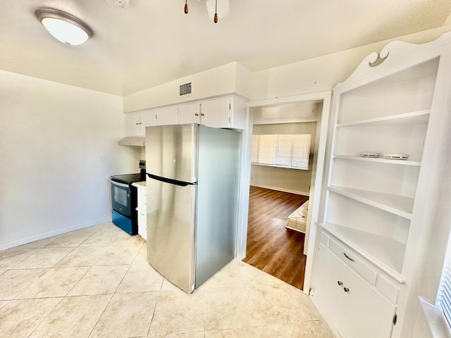535 W Peralta Way, Fresno, CA 93705 - kitchen featuring appliances with stainless steel finishes, light tile patterned floors, white cabinets, and under cabinet range hood