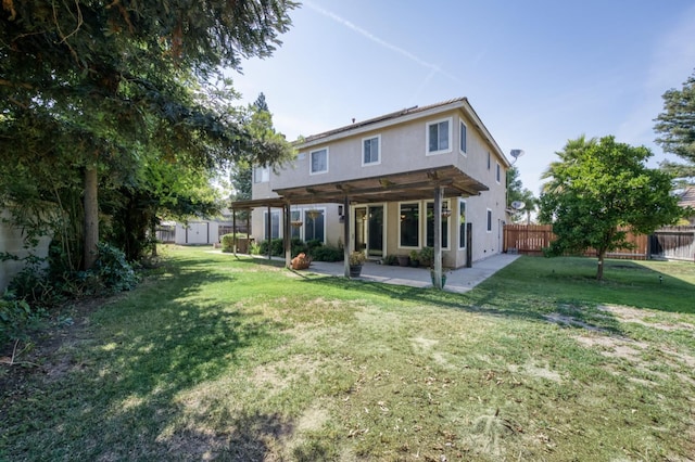 7718 N Constance Ave, Fresno, CA 93722 - rear view of property featuring a storage unit, stucco siding, a fenced backyard, and a patio area