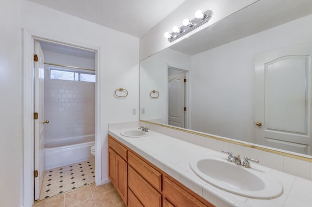 7718 N Constance Ave, Fresno, CA 93722 - bathroom featuring double vanity, tile patterned flooring, and shower / washtub combination