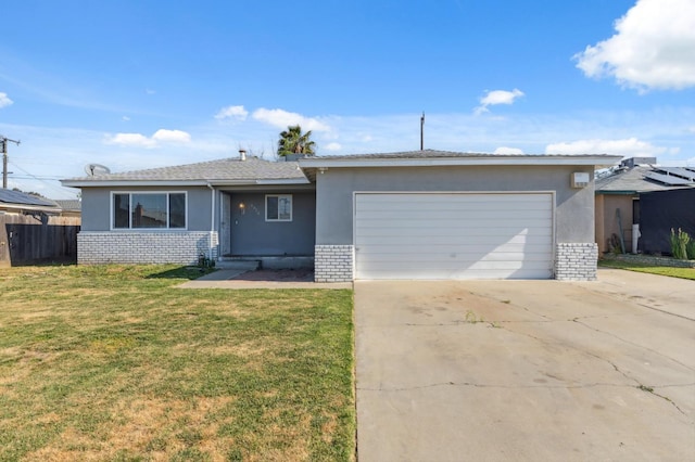 8620 La Vaca Way, Hanford, CA 93230 - ranch-style house with brick siding, driveway, a garage, and stucco siding