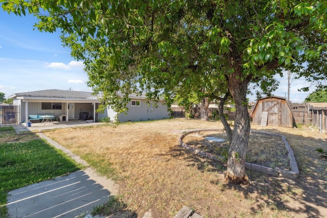8620 La Vaca Way, Hanford, CA 93230 - fenced backyard featuring a patio area and a storage unit