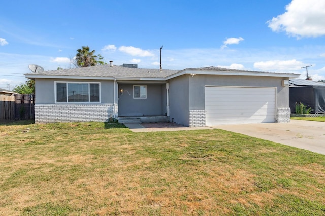 8620 La Vaca Way, Hanford, CA 93230 - ranch-style house with brick siding, an attached garage, driveway, and stucco siding