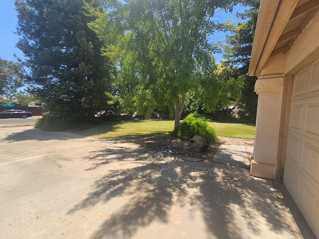 36883 Cloverleaf Ave, Madera, CA 93636 - view of grassy yard featuring a patio and a garage