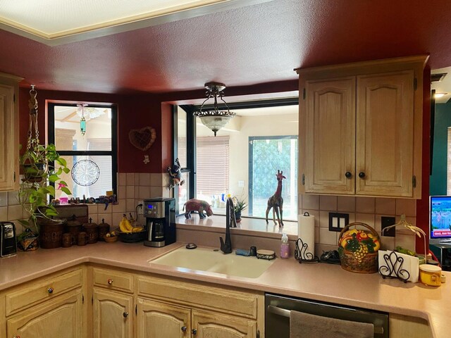 36883 Cloverleaf Ave, Madera, CA 93636 - kitchen featuring dishwashing machine, light countertops, and decorative backsplash