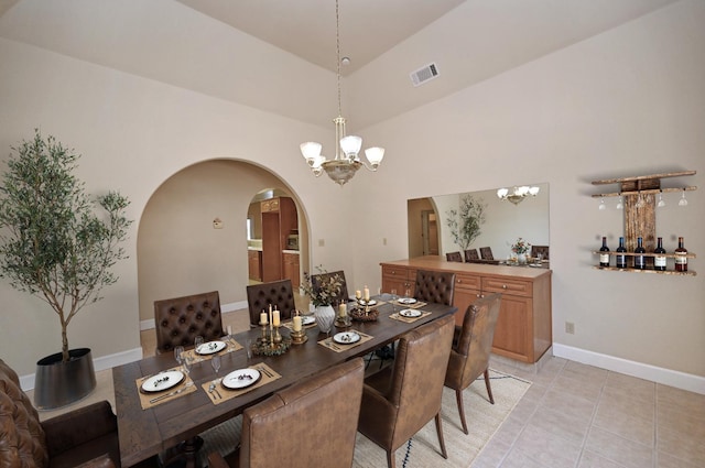 8037 E Morab Ave, Clovis, CA 93619 - dining space featuring a chandelier, arched walkways, and light tile patterned flooring
