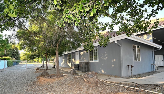 8037 E Morab Ave, Clovis, CA 93619 - view of property exterior with stucco siding and a cooling unit