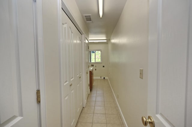 8037 E Morab Ave, Clovis, CA 93619 - hallway featuring light tile patterned floors and baseboards