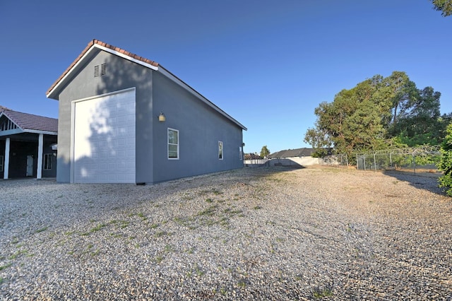 8037 E Morab Ave, Clovis, CA 93619 - view of side of property featuring stucco siding and an outbuilding