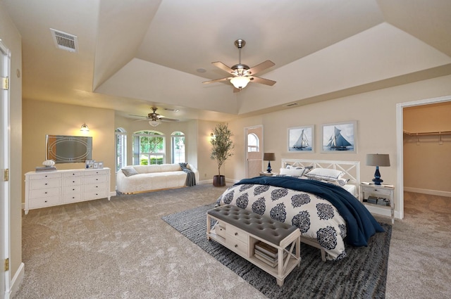 8037 E Morab Ave, Clovis, CA 93619 - carpeted bedroom with a tray ceiling, a walk in closet, and a ceiling fan