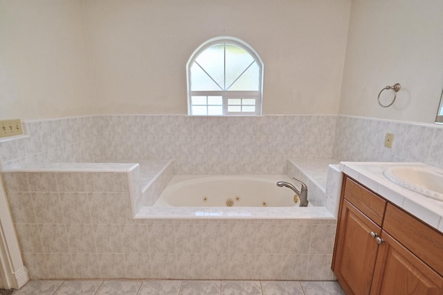 8037 E Morab Ave, Clovis, CA 93619 - bathroom with a tub with jets, vanity, and tile patterned floors
