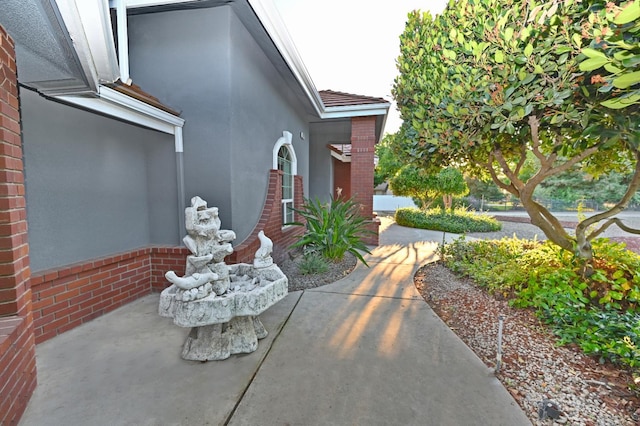 8037 E Morab Ave, Clovis, CA 93619 - view of home's exterior featuring brick siding and stucco siding