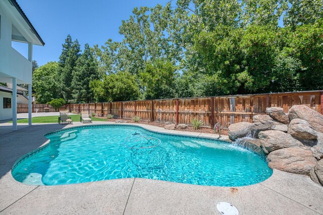1292 E Valley Forge Dr, Fresno, CA 93720 - view of pool with a patio, a fenced backyard, and view of wooded area