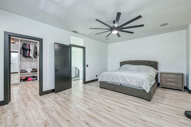 1292 E Valley Forge Dr, Fresno, CA 93720 - bedroom featuring wood finished floors, a spacious closet, a closet, and ceiling fan