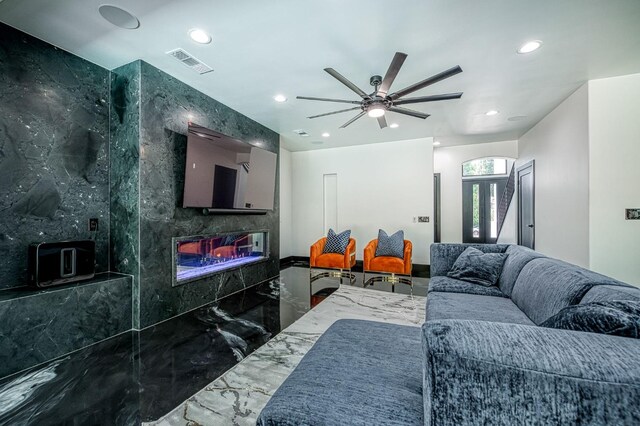 1292 E Valley Forge Dr, Fresno, CA 93720 - living area featuring marble tiled flooring, recessed lighting, a fireplace, and a ceiling fan